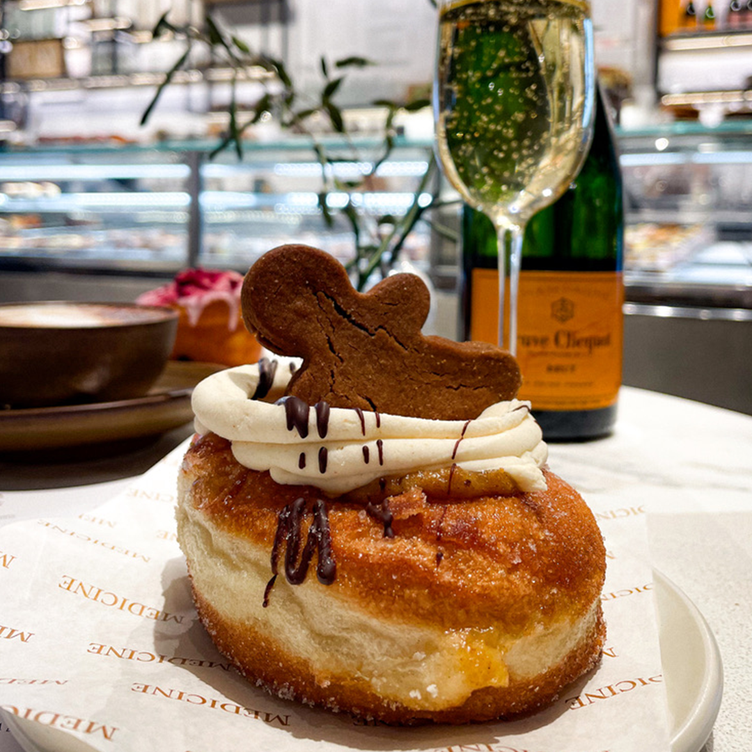 Gingerbread cronut with a glass of champagne